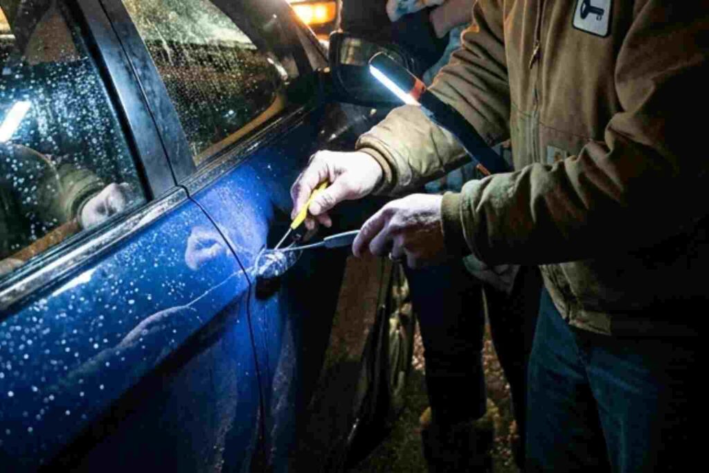 A 24/7 locksmith in Savoy, IL performing an emergency non-destructive car lockout service for a family at night.